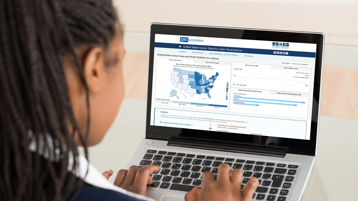 A woman looking at the Data Visualizations tool on her laptop